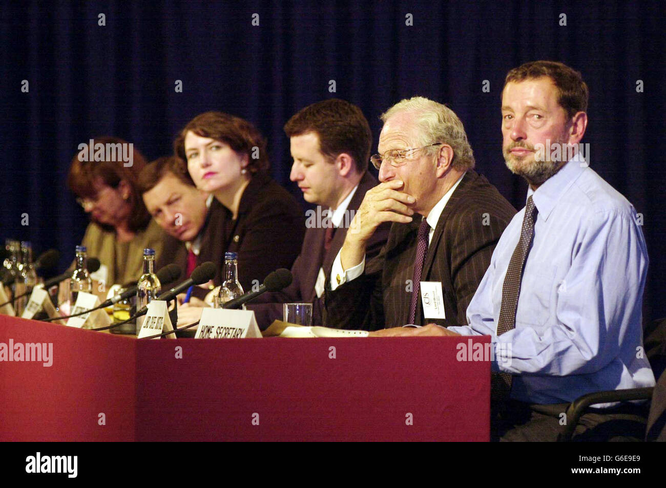 (From left - right) Solicitor-General for Scotland Elish Angiolini, Judge Alex Calabrese from Red Hook Community Court in USA, Community Prosecution Chief Jennifer Etheridge, Christopher Leslie MP, The Lord Chief Justice Lord Woolf and David Blunkett......... ............ during the conference entitled 'Criminal Justice Serving the Community' at the Queen Elizabeth II Conference Centre in central London. * Speaking at a major conference in London, Mr Blunkett called for a step change in law and order so that judges, prosecutors and defence lawyers all work to improve their communities. Stock Photo