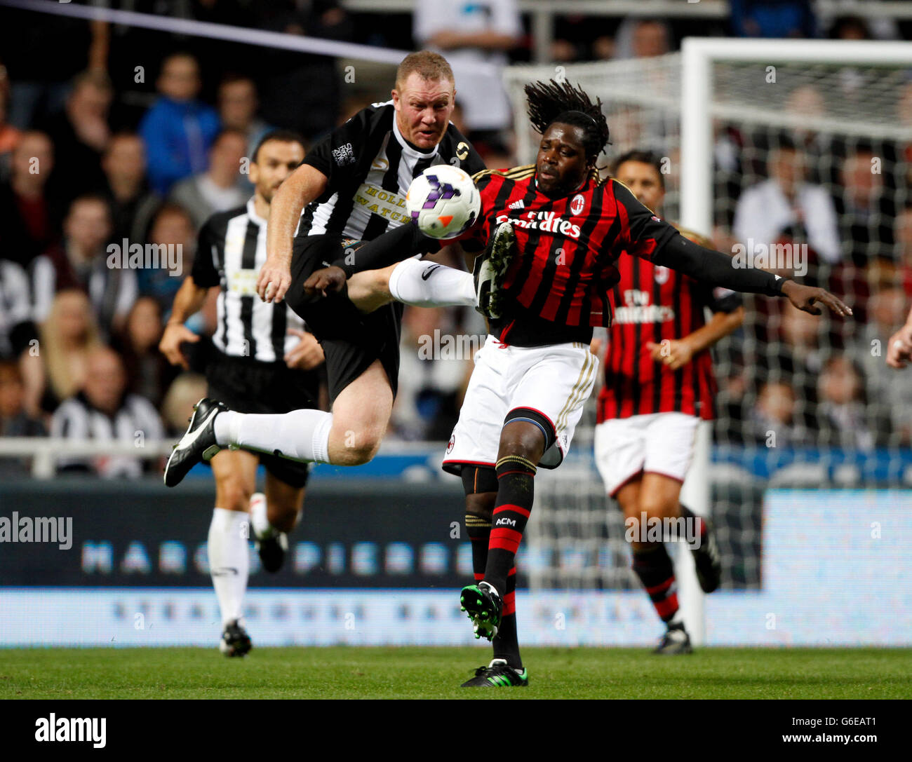 Newcastle's Steve Watson in action with AC Milan's Ibrahim Ba during the Steve Harper Testimonial at St James' Park, Newcastle. Stock Photo
