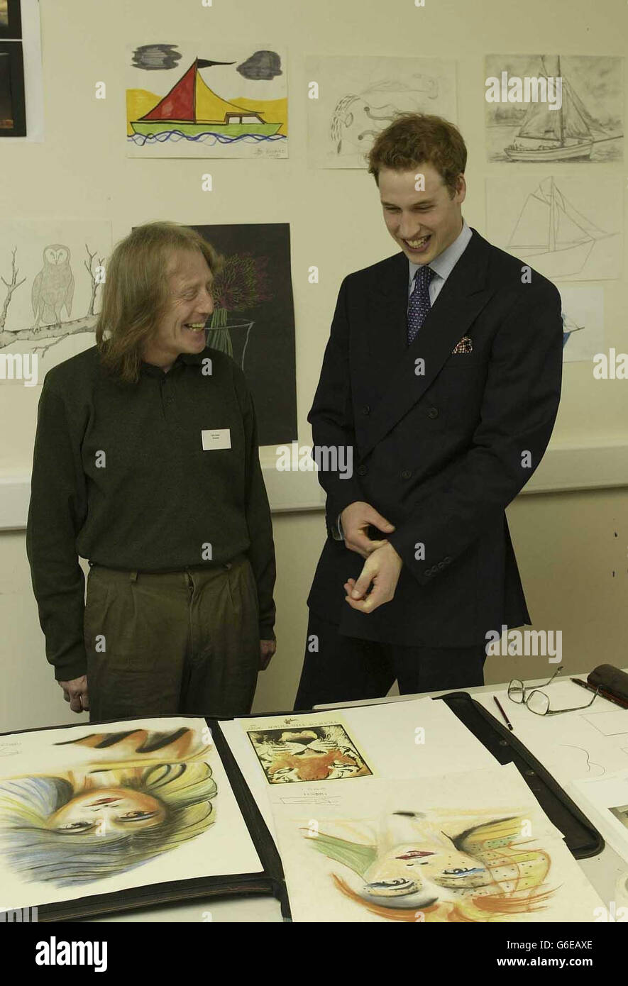 Prince William meets homeless Robert Jones in the art room of the NASH Homeless Centre, during the Prince's visit with his father, Prince Charles, to the centre in Newport, South Wales. Stock Photo
