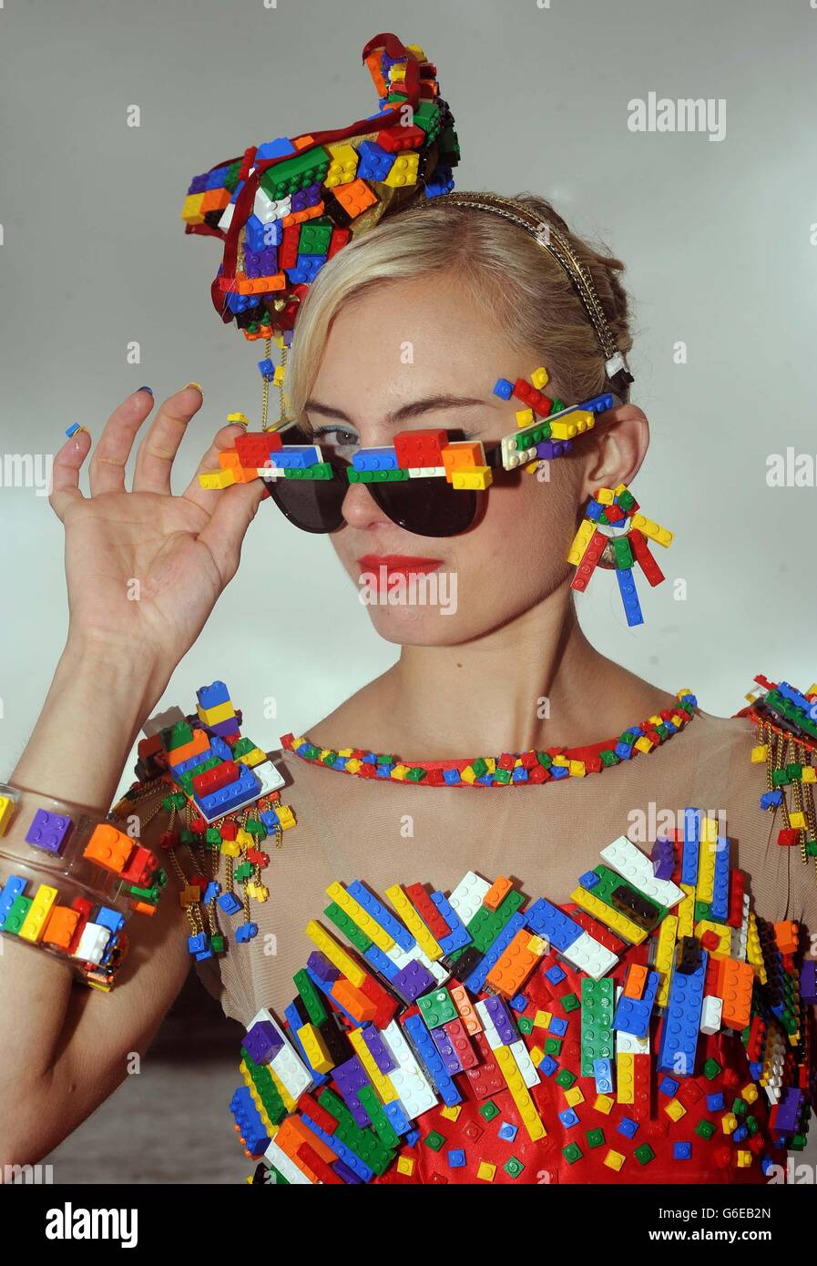 To get in to the spirit of London Fashion Week, model Aspen Glen-Cross  poses in a dress adorned with around 5000 LEGO bricks designed by Central  Saint Martins College of Art and