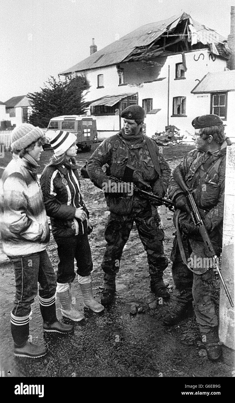 THE FALKLANDS WAR Port Stanley residents chat with Royal Marines as a