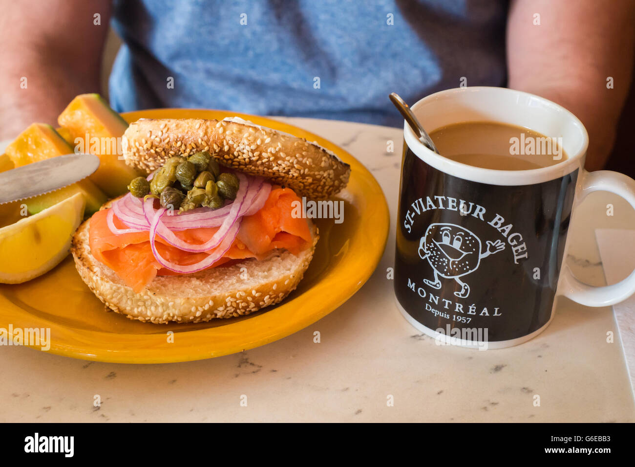Bagels on a plate with slamon, onions and capers at Bagel St-Viateur restaurant in Montreal, Canada Stock Photo