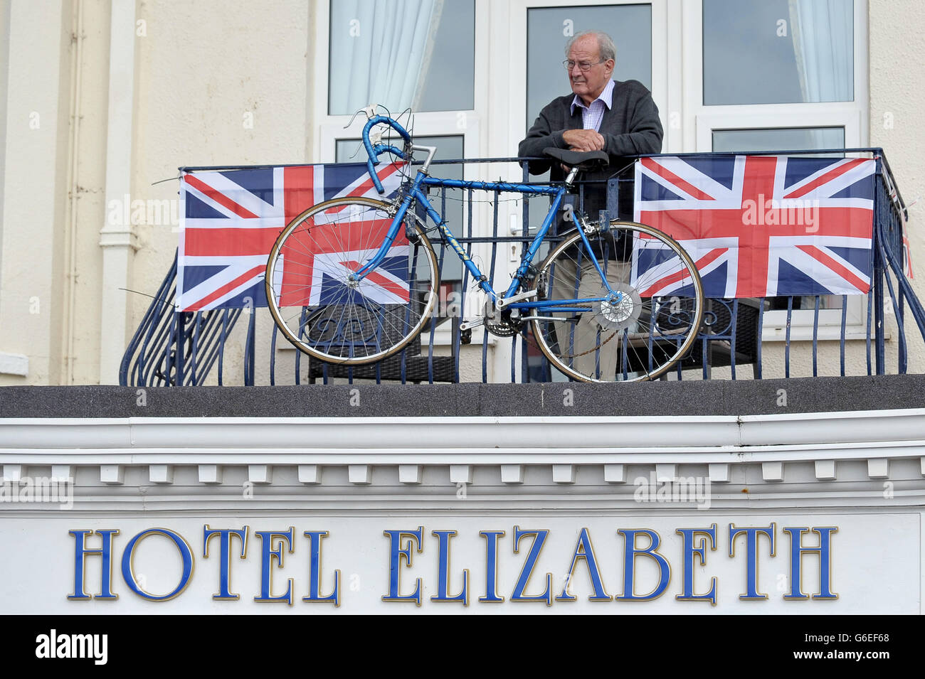 Cycling - 2013 Tour of Britain - Stage Six - Sidmouth to Haytor. A spectator on the seafront in Sidmouth ahead of stage six of the 2013 Tour of Britain from Sidmouth to Haytor. Stock Photo