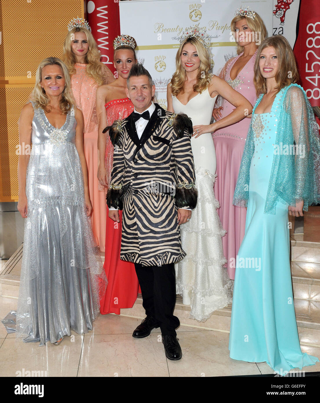 Former Miss England Georgia Horsley, who is set to marry Danny Jones of McFly (third right) poses with Eric Way (centre), before modeling in the Cirque Demelza Fashion show in aid of Demelza Hospice care for Children, Canary Wharf, London. Stock Photo