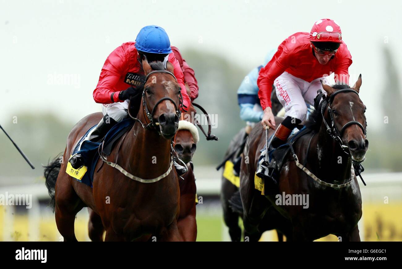 Supplicant ridden by Tony Hamilton (left) on their way to victory in the Dubai Duty Free Mill Reef Stakes during the Racing for Racegoers: Dubai Duty Free Weekend at Newbury Racecourse, Berkshire. Stock Photo