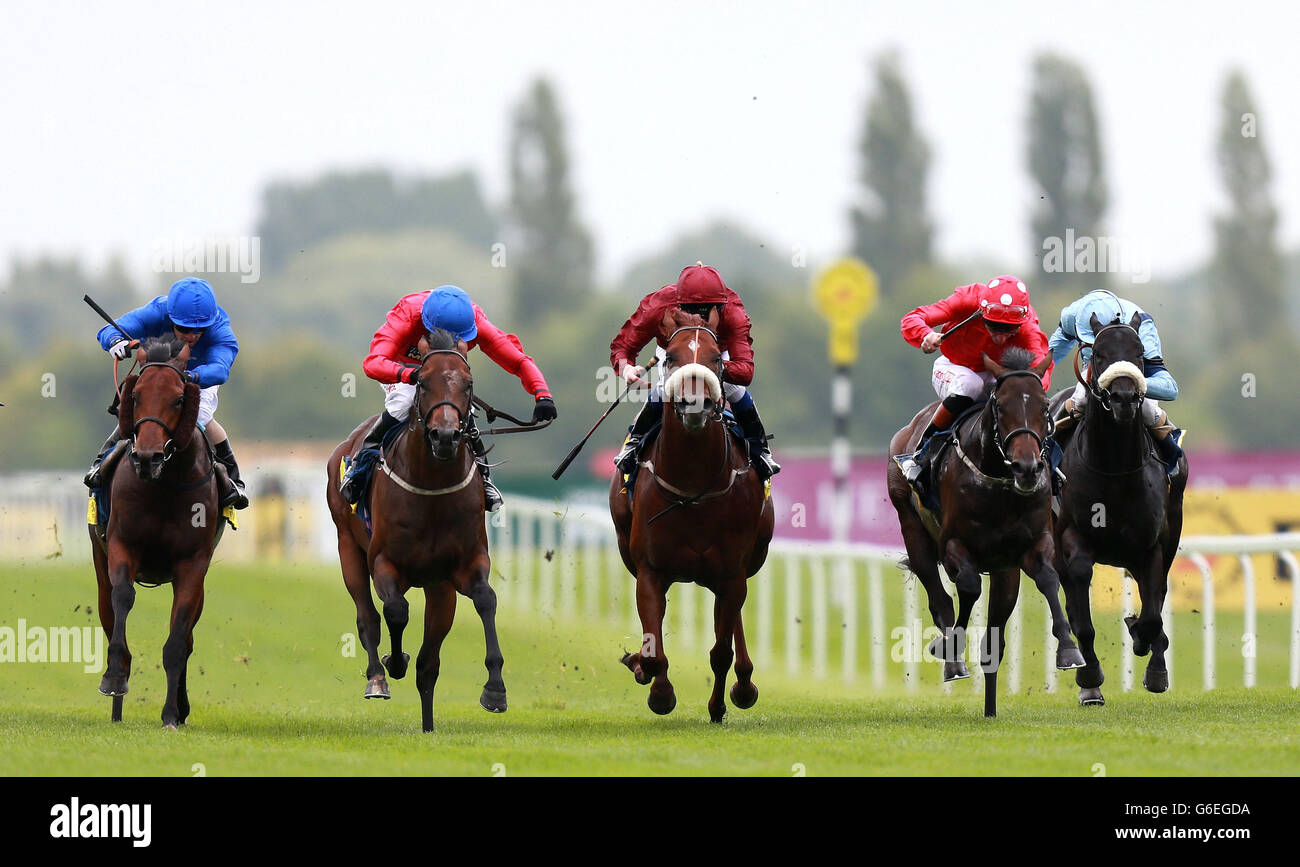 Eventual winner Supplicant ridden by Tony Hamilton (second left) in the Dubai Duty Free Mill Reef Stakes during the Racing for Racegoers: Dubai Duty Free Weekend at Newbury Racecourse, Berkshire. Stock Photo