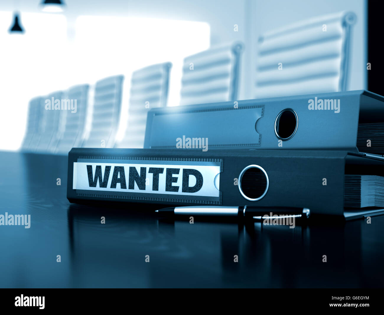 Wanted on File Folder. Blurred Image. Stock Photo