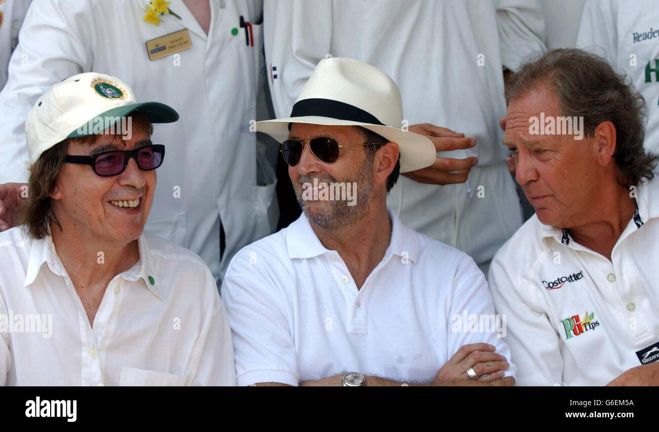 From left to right; former Rolling Stones guitarist Bill Wyman, rock legend Eric Clapton and Bunbury founder David English take a break as Eric captains his celebrity team against Alec Stewart's Bunbury side in celebration of the England player's testimonial year at Ripley Court School in Surrey. Proceeds from the event will be divided between the Testimonial, NSPCC's Full Stop Campaign and the Cross Roads Clinic, Antigua. Stock Photo