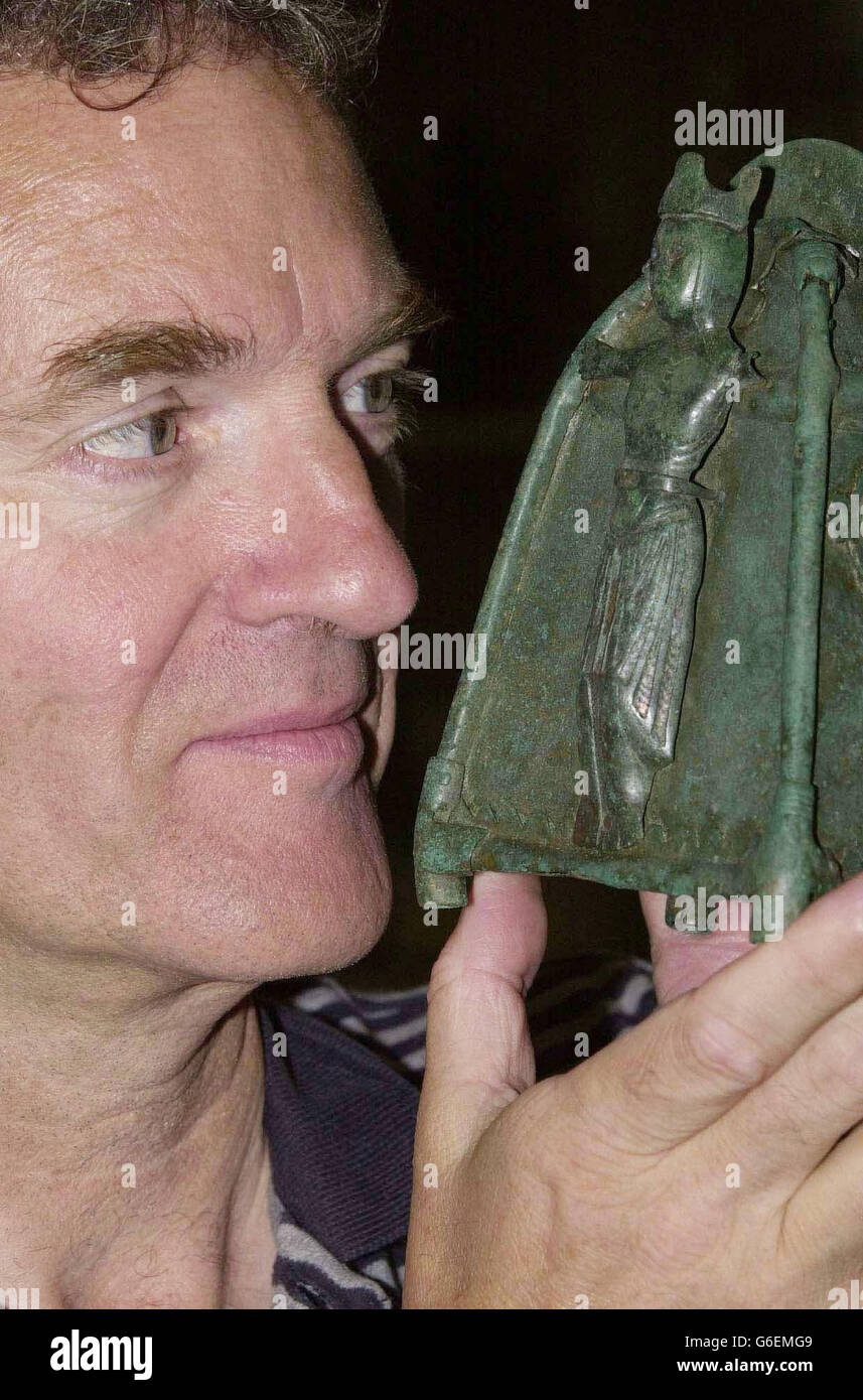 Archaeologist, Brian Williams, at his laboratory in Belfast, following the discovery of a 12th Century holy relic in Northern Ireland. Williams, joint excavation director of the Environment and Heritage Service (EHS), came across the extremely rare and beautiful bronze bell shrine during a dig near Ballycastle, Co Antrim. He said: 'I was digging in a pit and the soil just fell away from it and I could see the side of it and realised immediately it was going to be a very important piece. 'Then I removed it and I just felt it was the find of my life. Stock Photo