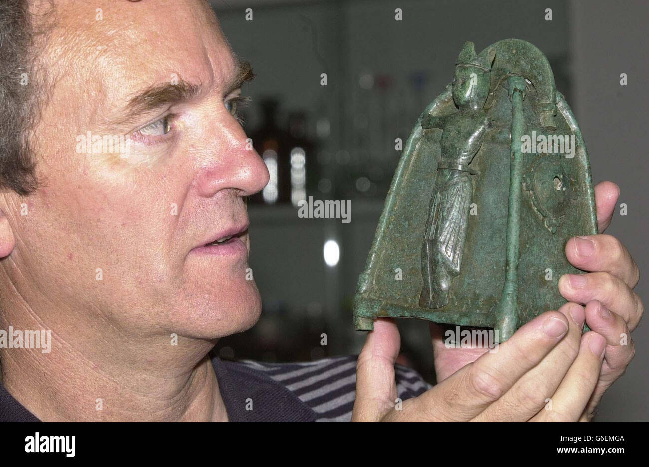 Archaeologist, Brian Williams, at his laboratory in Belfast, following the discovery of a 12th Century holy relic in Northern Ireland. * Williams, joint excavation director of the Environment and Heritage Service (EHS), came across the extremely rare and beautiful bronze bell shrine during a dig near Ballycastle, Co Antrim. He said: 'I was digging in a pit and the soil just fell away from it and I could see the side of it and realised immediately it was going to be a very important piece. 'Then I removed it and I just felt it was the find of my life. Stock Photo