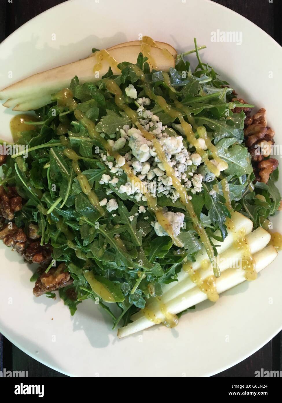 Arugula rocket salad with pears, walnuts, bleu cheese and drizzle Stock ...
