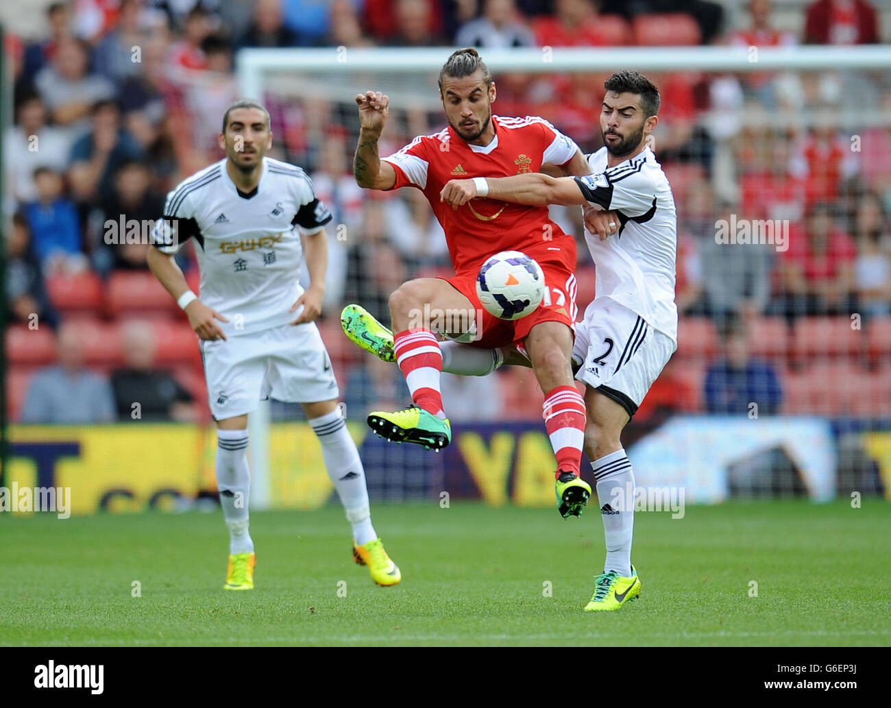 Southampton's Pablo Daniel Osvaldo (left) is tackled by Swansea's Jordi Amat during the Barclays Premier League match at St Marys, Southampton. Stock Photo