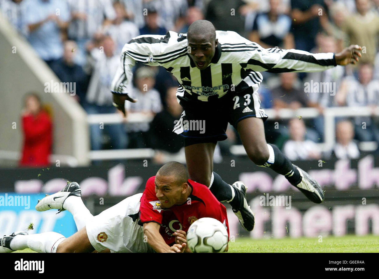Newcastle's Shola Ameobi (above) is brought down in the box by ...