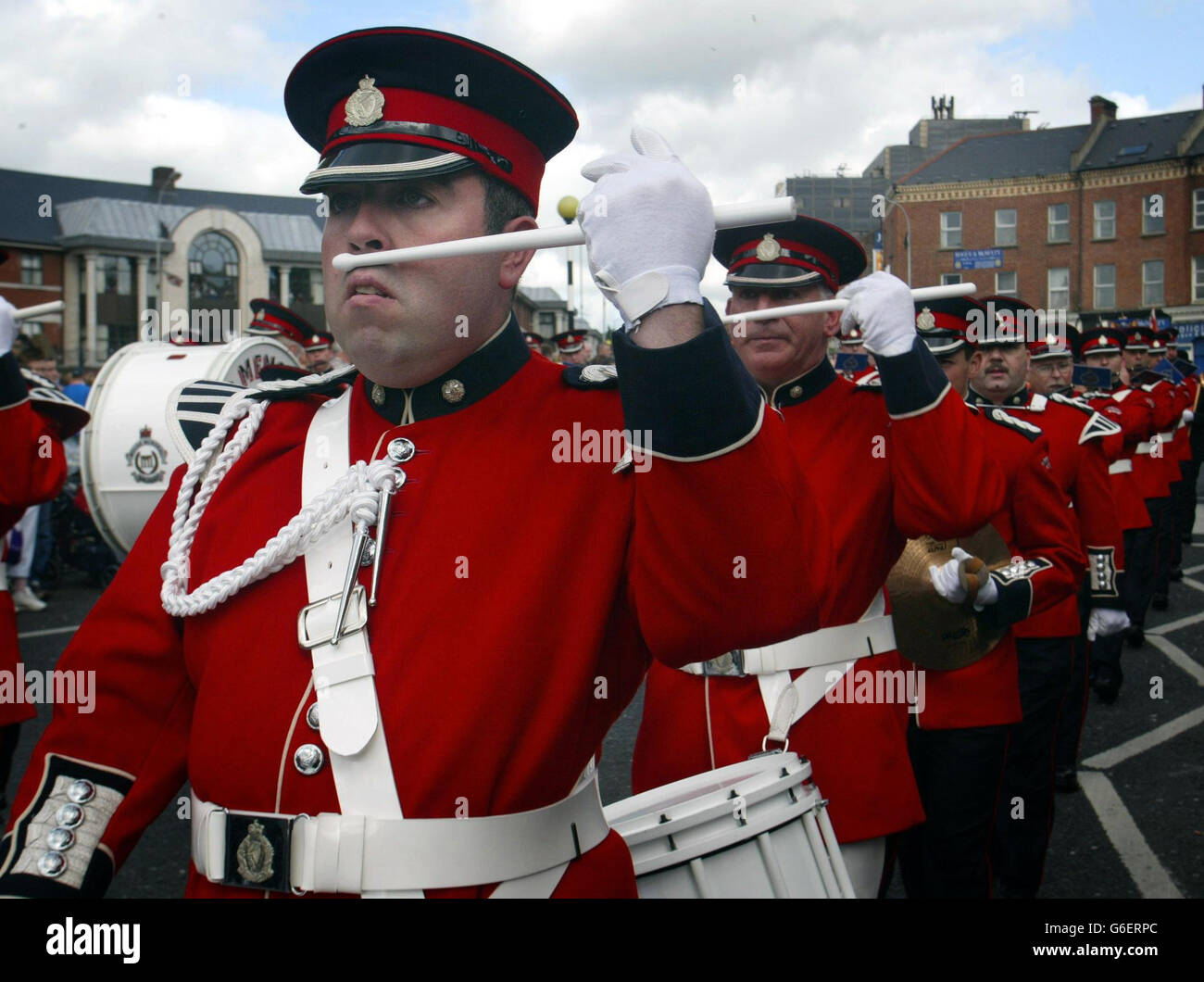 An Orange Order parade passes through Belfast. Tens of thousands of
