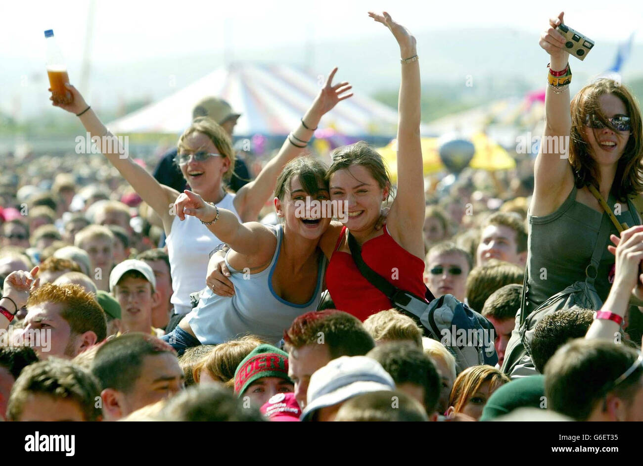 Revellers at T in the Park near Balerno in Scotland during the opening acts of the 10th Anniversary of the Scottish concert. Stock Photo