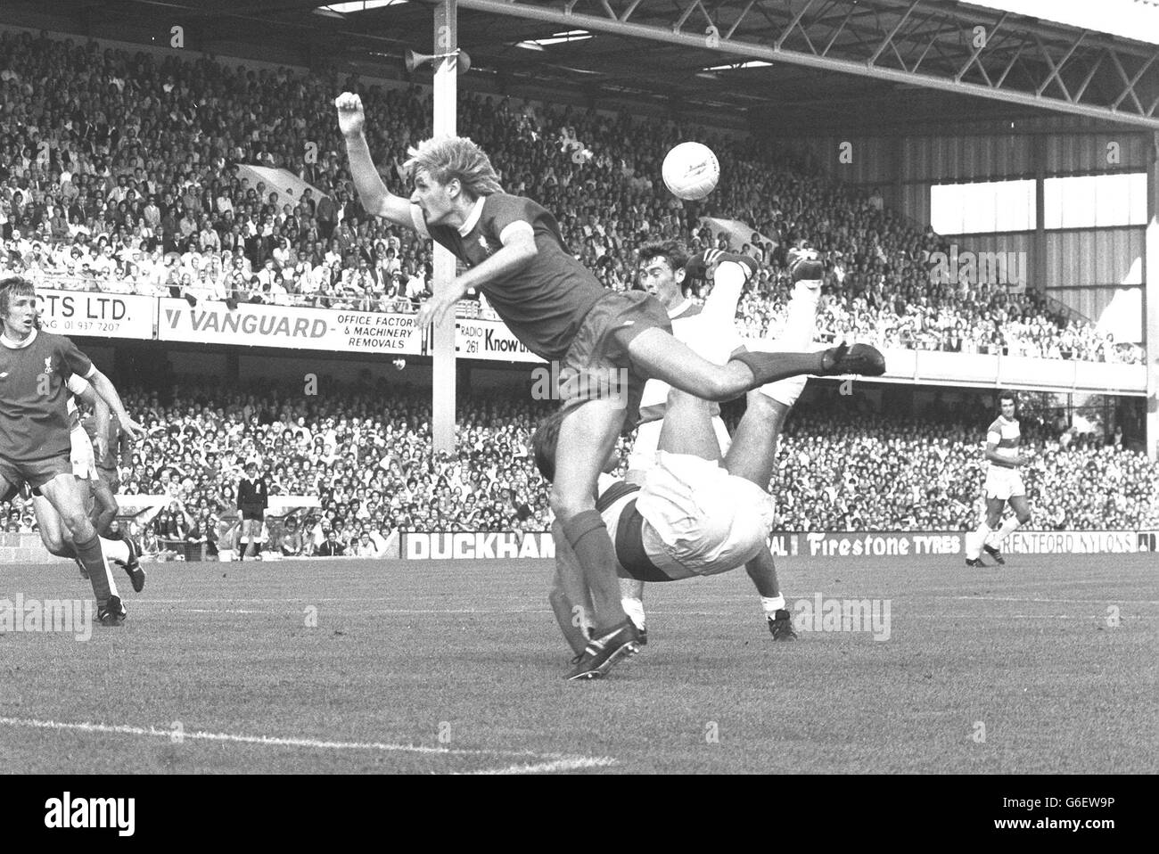 A buttocks view of David Webb of QPR trying an overhead kick in a duel with Phil Thompson (left) of Liverpool, during their Football League Division One game at Rangers Stadium, Shepherds Bush today. Stock Photo