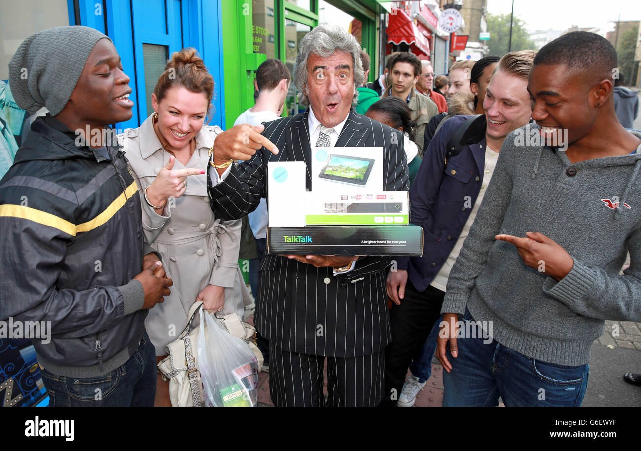 EDITORIAL USE ONLY Television personality and presenter of Bargain Hunt David Dickinson opens a