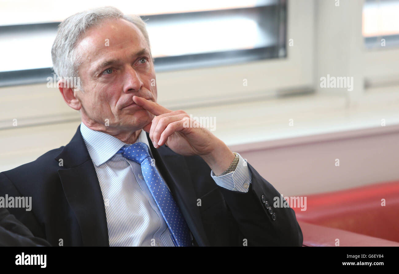 Minister for Jobs, Enterprise and Innovation Richard Bruton, listen as Qualtrics co-founder chief executive Ryan Smith (right) speaks, during the company's official opening of their European headquarters, at Earlsfort Terrace in Dublin city centre. Stock Photo