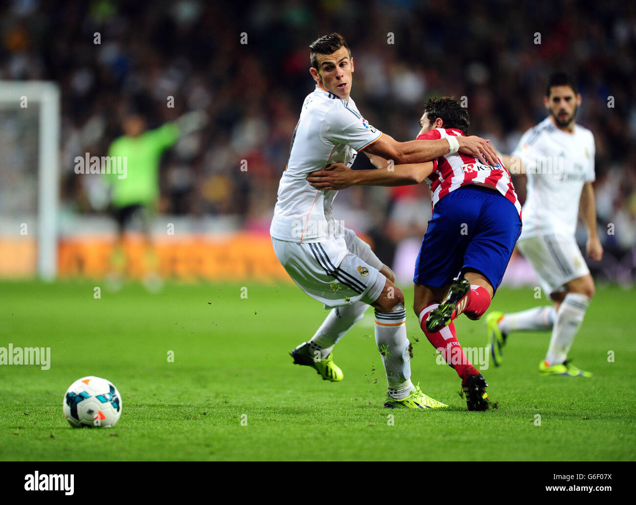 Real Madrid's Gareth Bale and Atletico Madrid's Godin battle for the ball during the La Liga match at Santiago Bernabeu, Madrid, Spain. Stock Photo