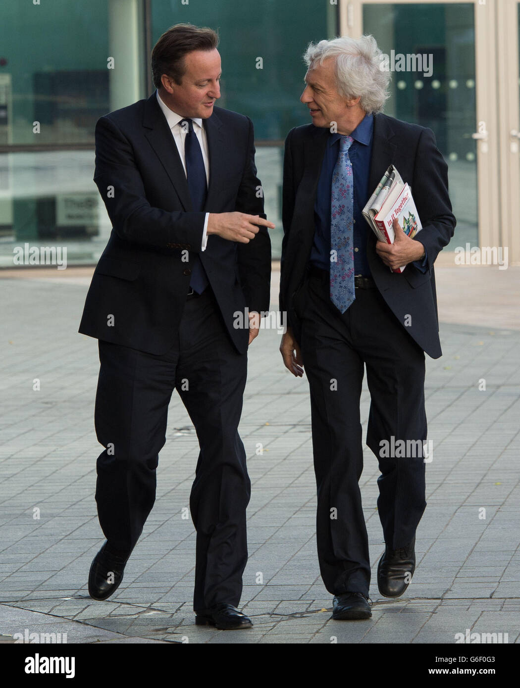 Prime Minister David Cameron (left) arriving for the BBC current affairs programme, The Andrew Marr show in Manchester, before the start of the Conservative Party annual conference. Stock Photo