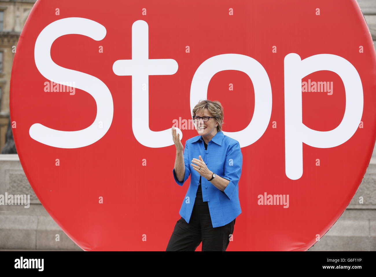 Chief Medical Officer, Professor Dame Sally Davies, stands before a three metre high disk in Trafalgar Square, London, to launch 'Stoptober', a campaign to get people to give up smoking. Stock Photo