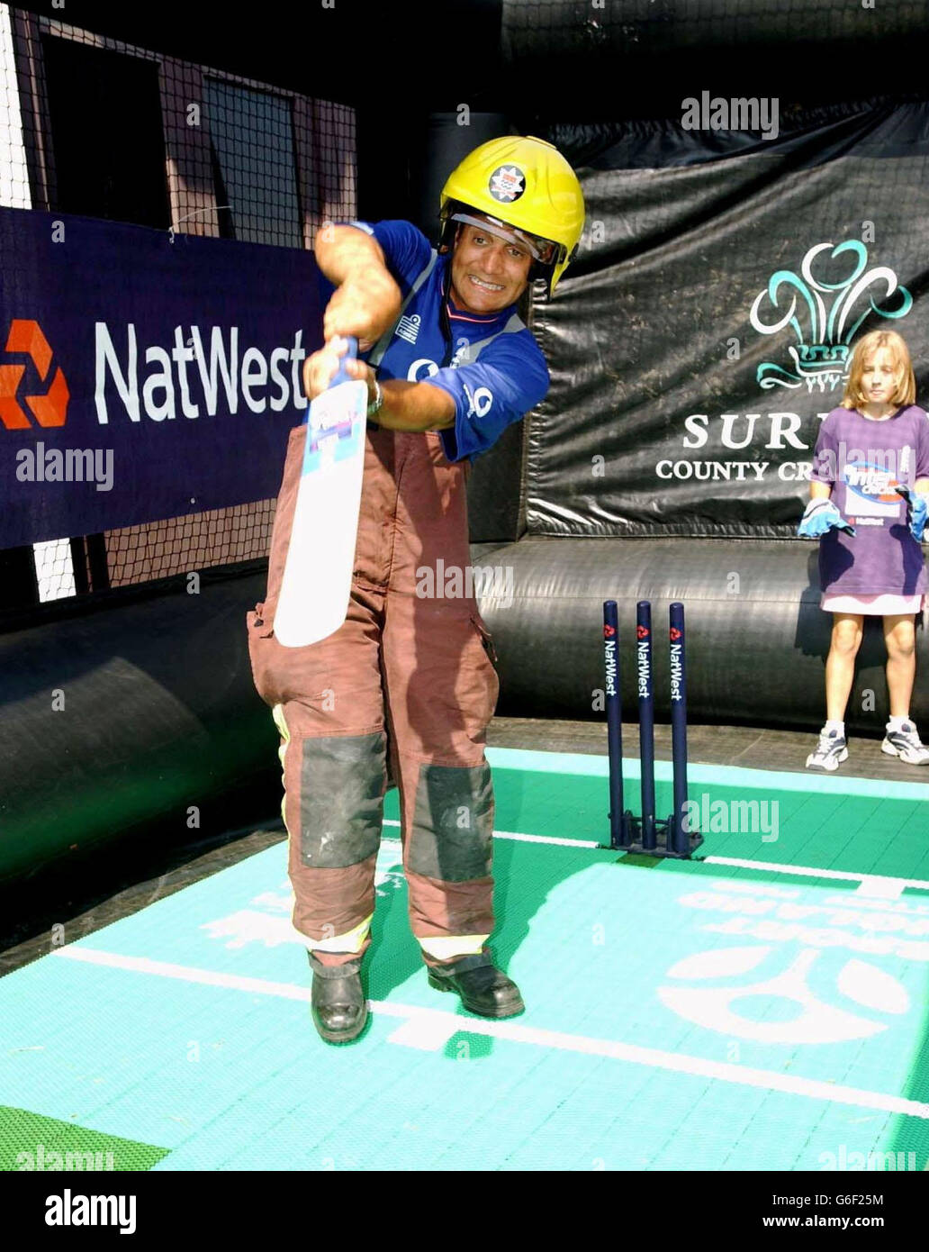 England and Surrey cricketer Mark Butcher joins local children at Croydon Fire Station to mark the launch of the NatWest Inter Cricket Summer Schools programme. This four day Summer School gives youngsters the chance to learn about Inter Cricket and develop new skills to improve their game under the expert guidance and tuition of Surrey County Cricket Club coaches. Stock Photo
