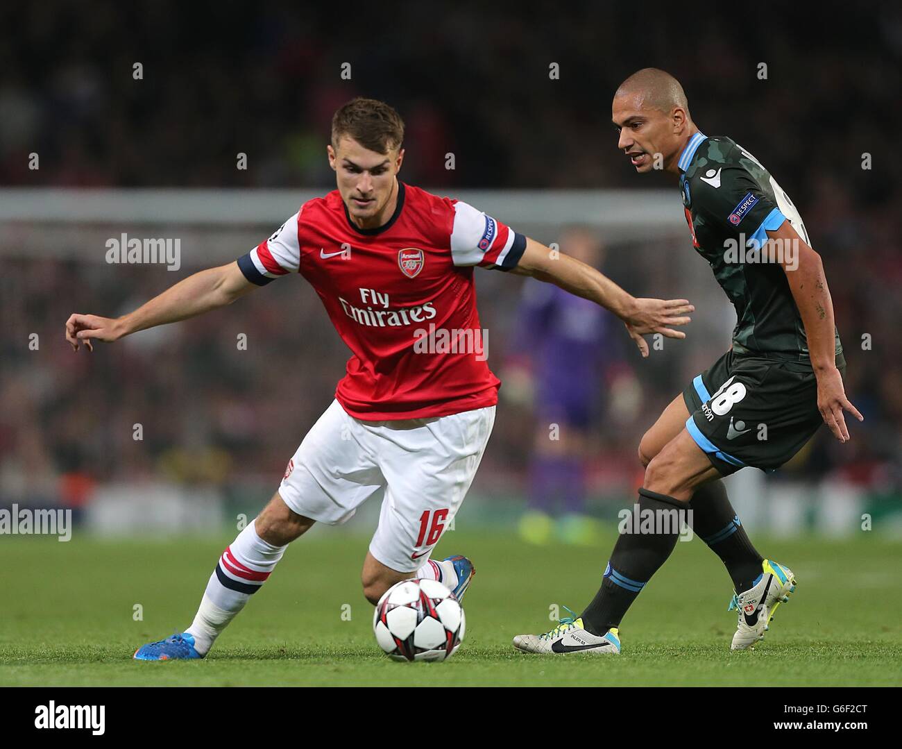 Napoli's Gokhan Inler (right) and Arsenal's Aaron Ramsey (left) battle for the ball Stock Photo
