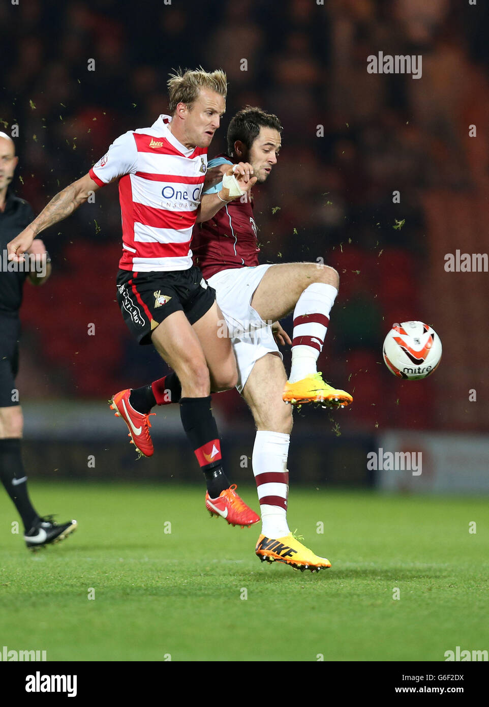 doncaster-rovers-james-coppinger-and-burnleys-danny-ings-hi-res-stock