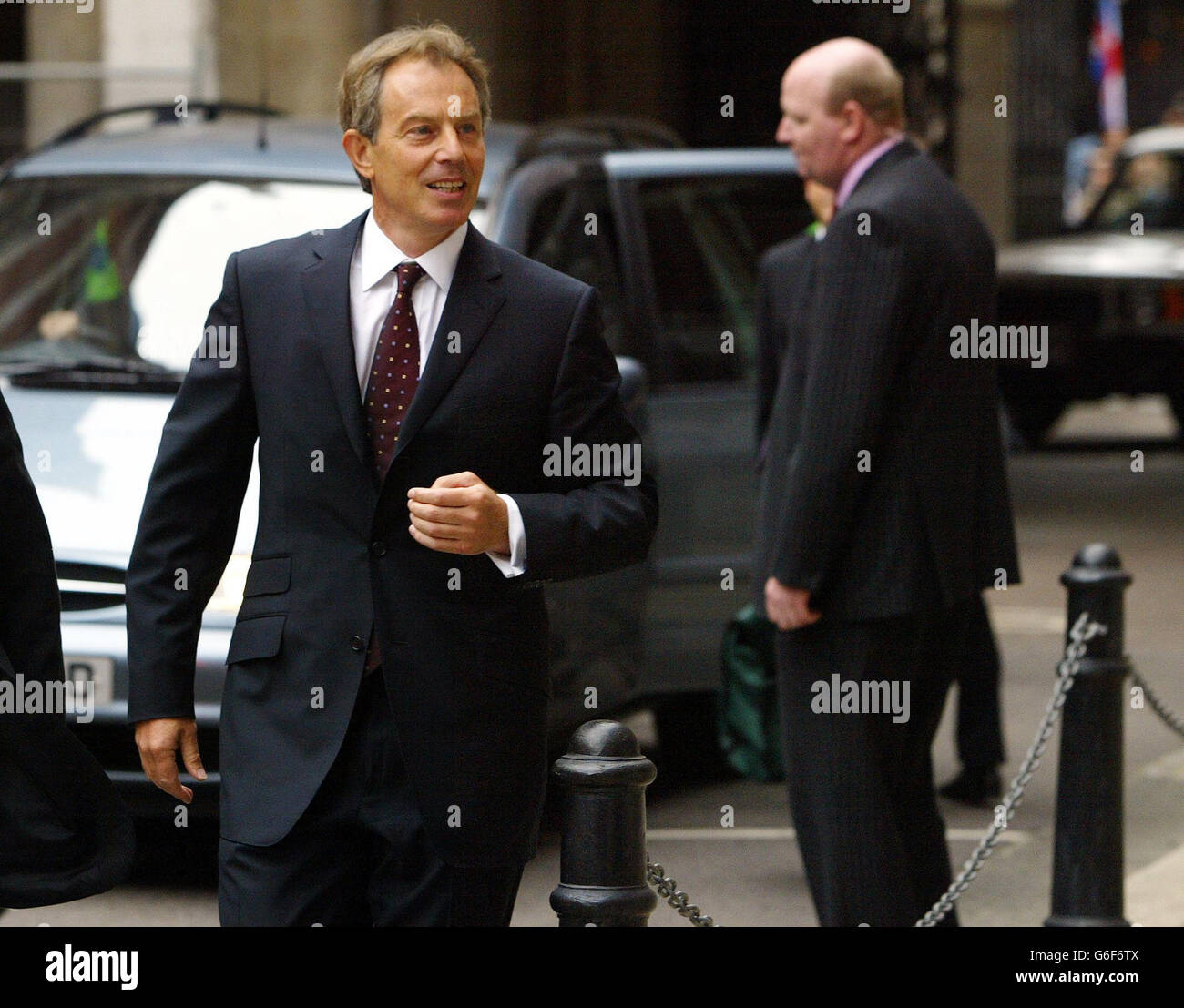 British Prime Minister Tony Blair arriving at the High Court in London to give evidence to the Hutton enquiry explaining his role in events leading up to the apparent suicide of Government weapons expert Dr David Kelly. The Hutton Inquiry was set up to investigate how Dr Kelly apparently came to take his own life after being identified as the likely source of a report by BBC Radio 4 Today programme`s defence correspondent Andrew Gilligan, in which the journalist suggested that the dossier was transformed at Downing Street`s behest. Stock Photo