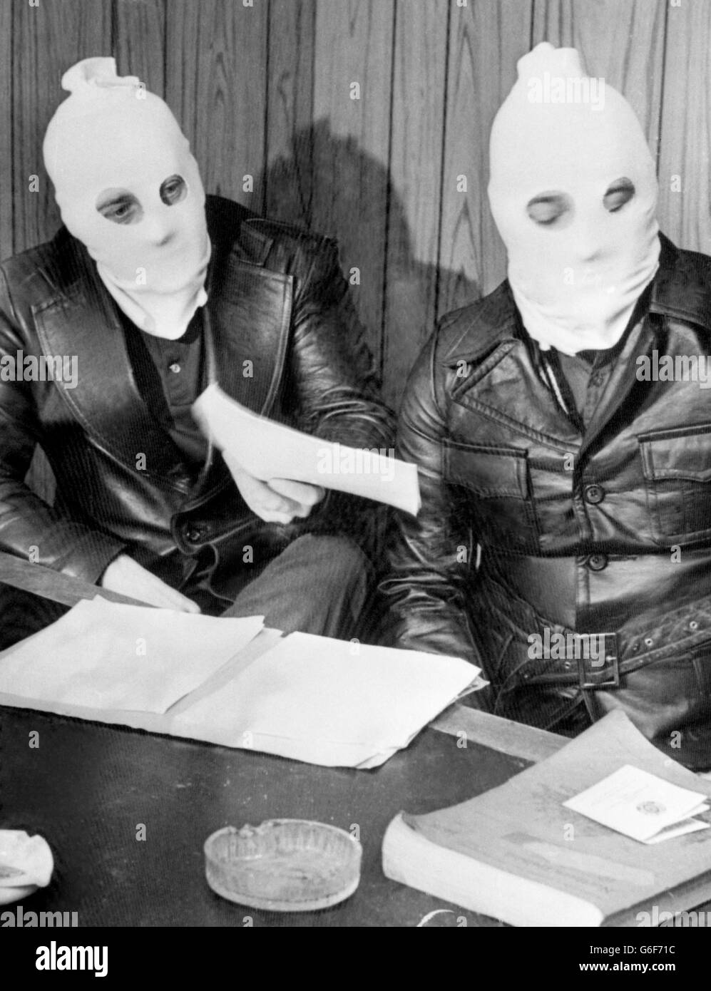 Hooded leaders of the Ulster Volunteer Force at a press conference in Belfast. Two members of the Ulster Defence Association were shot dead over the weekend by masked gunmen. Stock Photo