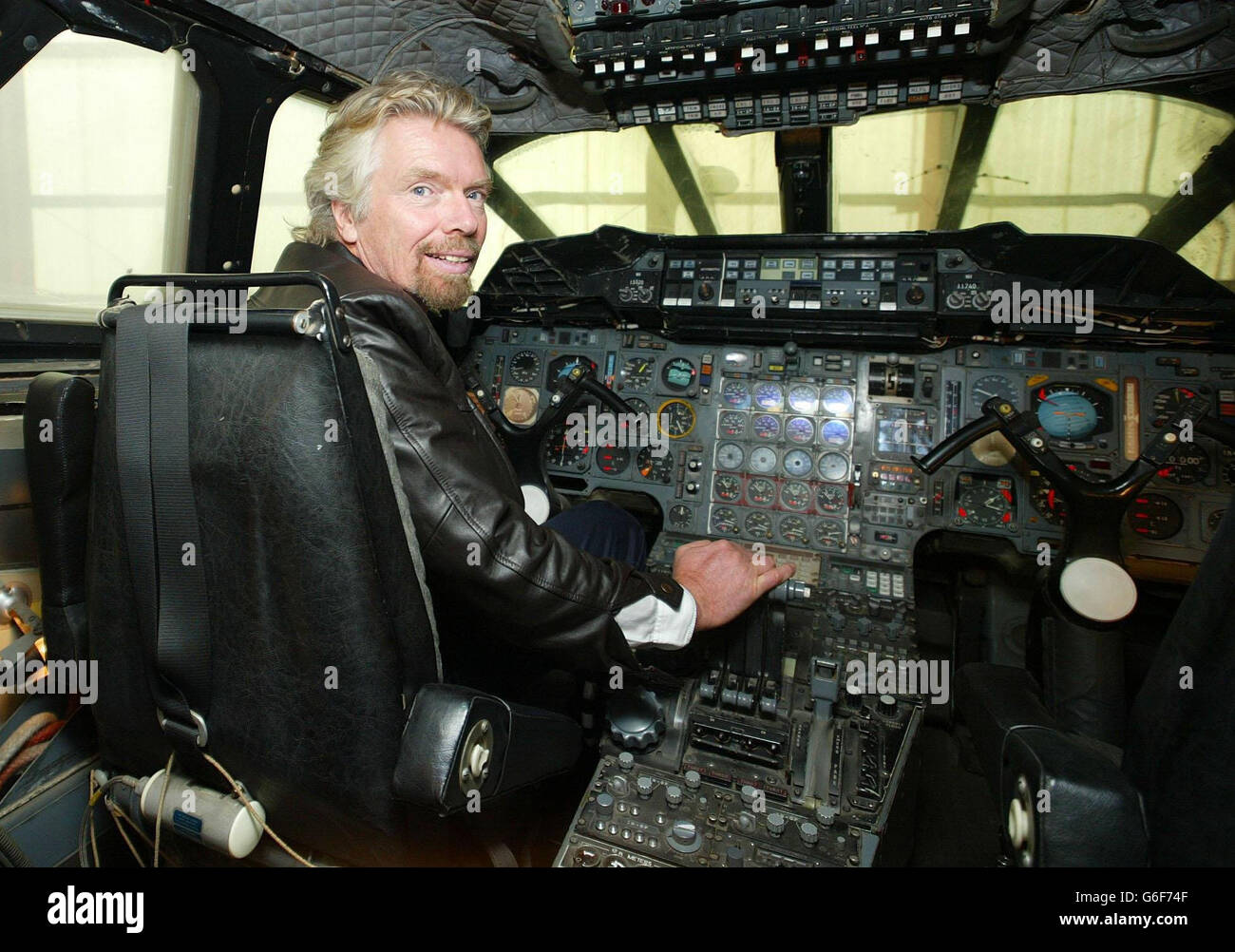 Sir Richard Branson examines one of the first Concordes, on show at the Imperial War Museum in Duxford, Cambs, before meeting Airbus officials as part of his attempts to revive the supersonic airliner which is due to be grounded by British Airways in October. Stock Photo