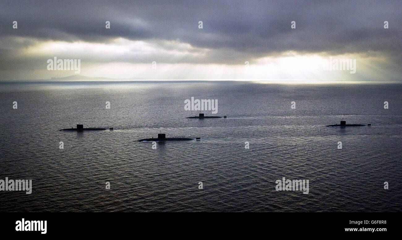 The British nuclear submarine HMS Splendid (left) travels in the