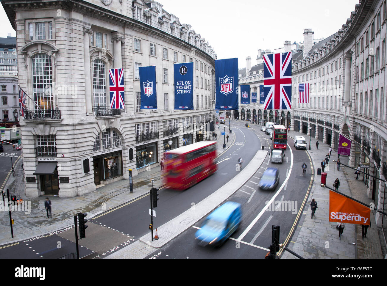 American NFL (National Football League) flags are displayed above Regent Street, central London, in preparation for NFL on Regent Street - the traffic free event on Saturday 28th September ahead of the NFL's forthcoming International Series in London. Stock Photo