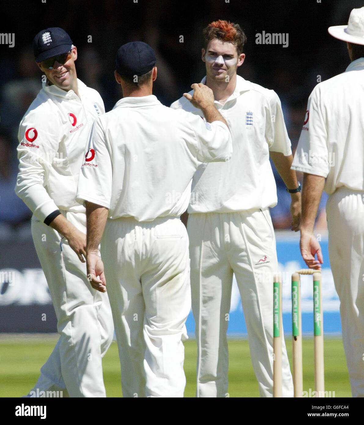 England's James Anderson (facing) is congratulated by team-mates Nasser Hussain and Marcus Trescothick (left) after clean bowling South African captain Graeme Smith for 259 runs on the 3rd day of the second nPower Test at Lord's, St John's Wood, London. Stock Photo