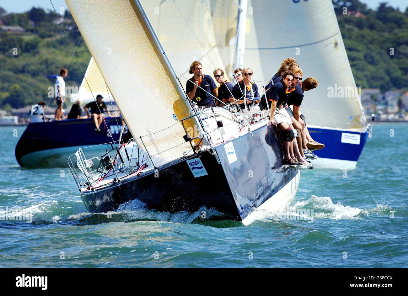 The dutch class two yacht Holmatro racing on the Solent during the first day of Skandia Cowes Week. The annual regatta on the Isle of Wight is the biggest sailing event in the world, and lasts for eight days. Stock Photo