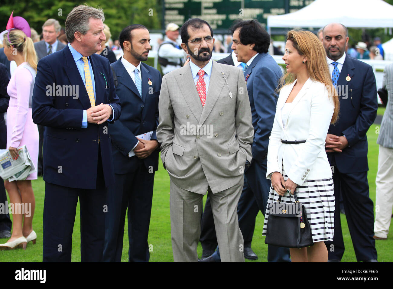 Horse Racing - 2013 Glorious Goodwood Festival - QIPCO Sussex Stakes Day - Goodwood Racecourse. Owner Sheikh Mohammed bin Rashed al-Maktoum speaks with his wife Princess Haya bint Al Hussein Stock Photo