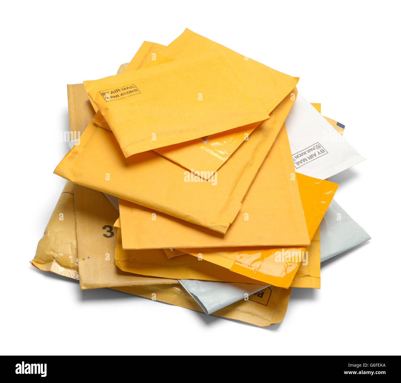 Small Pile of Yellow Padded Envelopes Isolated on White Background. Stock Photo