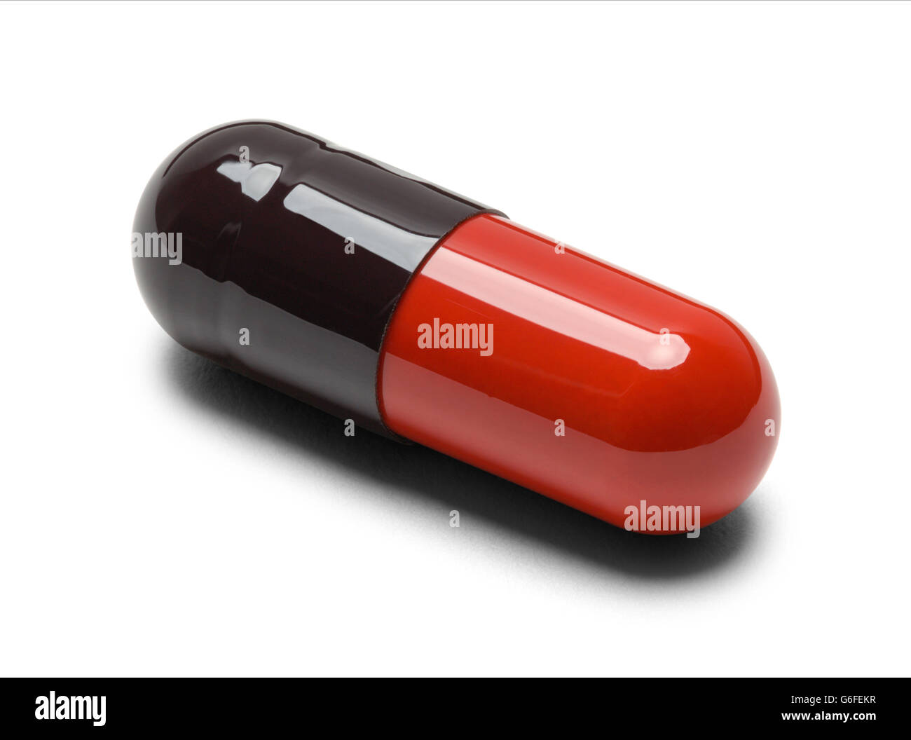 One Red and Black Pill Capsule Isolate on White Background. Stock Photo