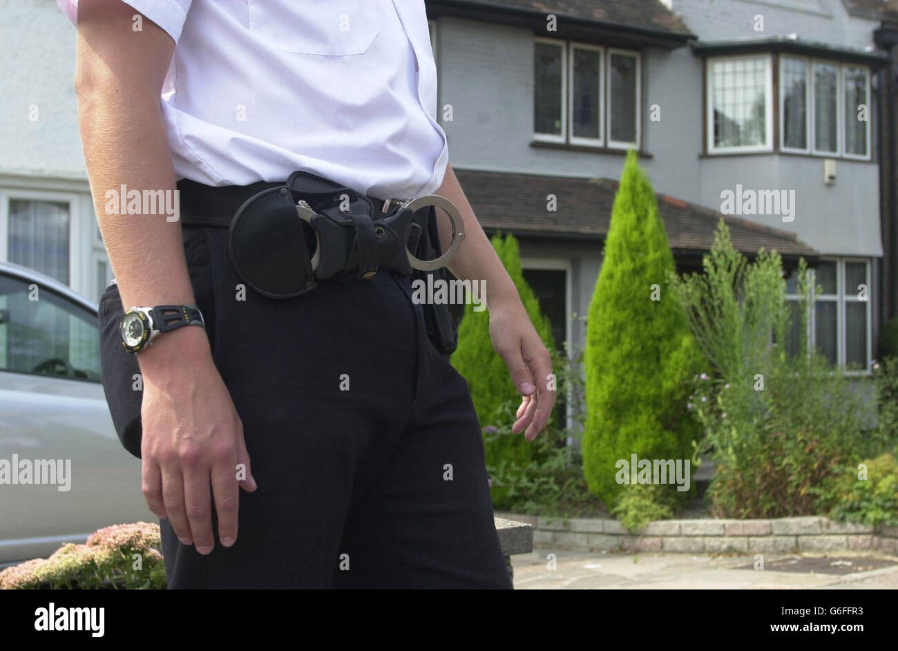 A policeman keeps guard outside a house believed to be that of Mr Lakhani, the man arrested by police in the United States of America for allegedly trying to sell a missile to terrorists, in Hendon, north-west London. * The man was arrested following an undercover operation. He is due to face charges in court in the United States. Stock Photo