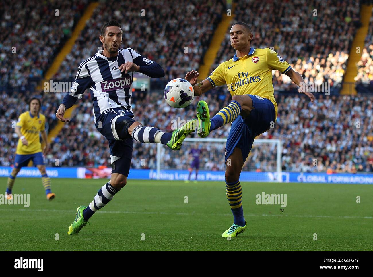 Soccer - Barclays Premier League - West Bromwich Albion v Arsenal - The Hawthorns. Arsenal's Kieran Gibbs (right) and West Bromwich Albion's Morgan Amalfitano battle for the ball Stock Photo