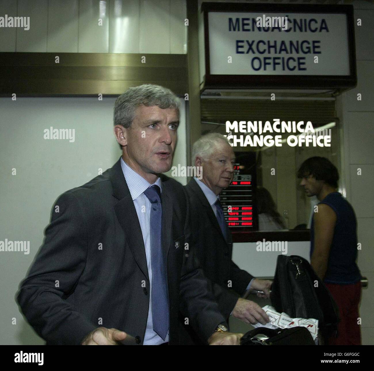 Wales football Manager Mark Hughes (left) arrives with coach Eddie