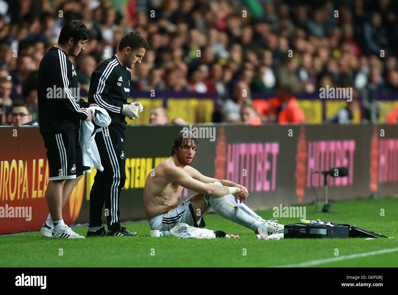 Soccer - UEFA Europa League - Group A - Swansea City v St Gallen - Liberty Stadium. Swansea City's Miguel Michu is treated for an injury Stock Photo