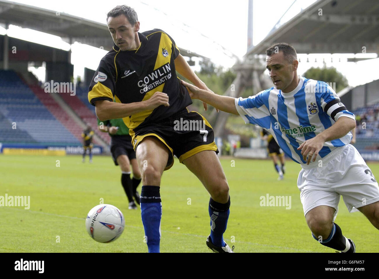 Huddersfield's captain, Rob Edwards takes on Bristol Rovers' Dave Savage (L), during their Nationwide Division Three match at Huddersfield's Alfred McAlpine Stadium. NO UNOFFICIAL CLUB WEBSITE USE. Stock Photo