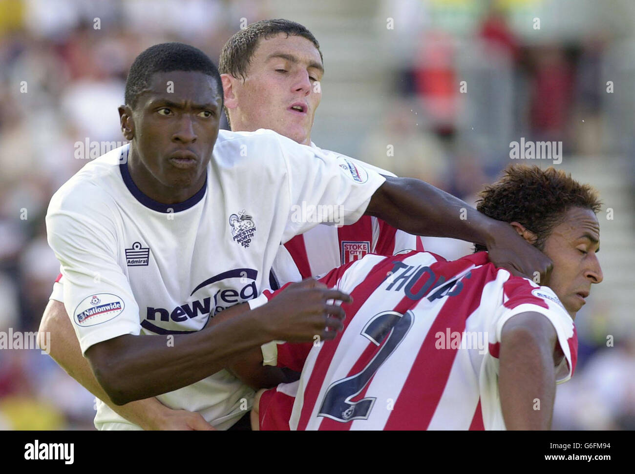 Preston's Dickson Etuhu (left) finds a Stoke's Wayne Thomas, during their Nationwide Division One match at Preston's Deepdale ground. Final score: Preston 1, Stoke City nil. NO UNOFFICIAL CLUB WEBSITE USE. Stock Photo