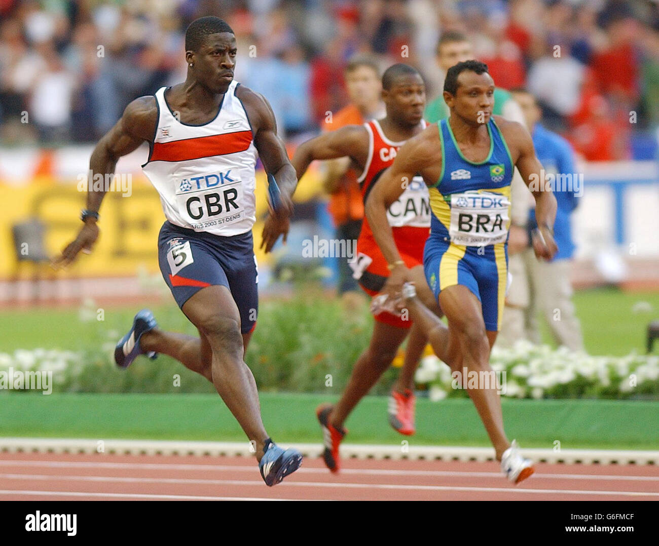 Dwain Chambers of Great Britain (left) powers home to give the GB 4x100 relay team victory in the Semi Final of the relay at the Athletics World Championships in Paris. Stock Photo