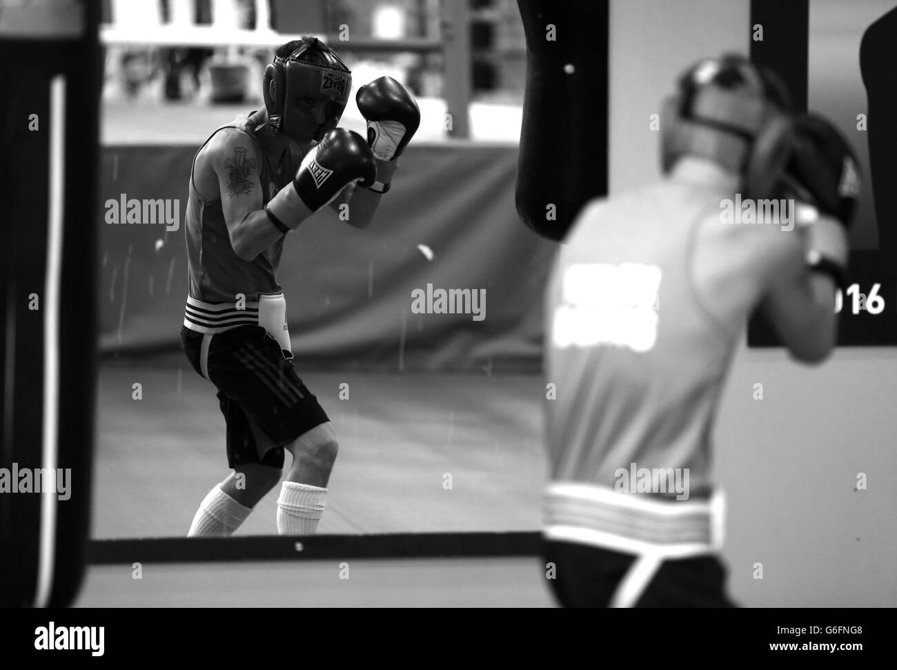 A boxer shadow box in the mirrors during the Team GB Media Day at the English Institute of Sport, Sheffield. Stock Photo