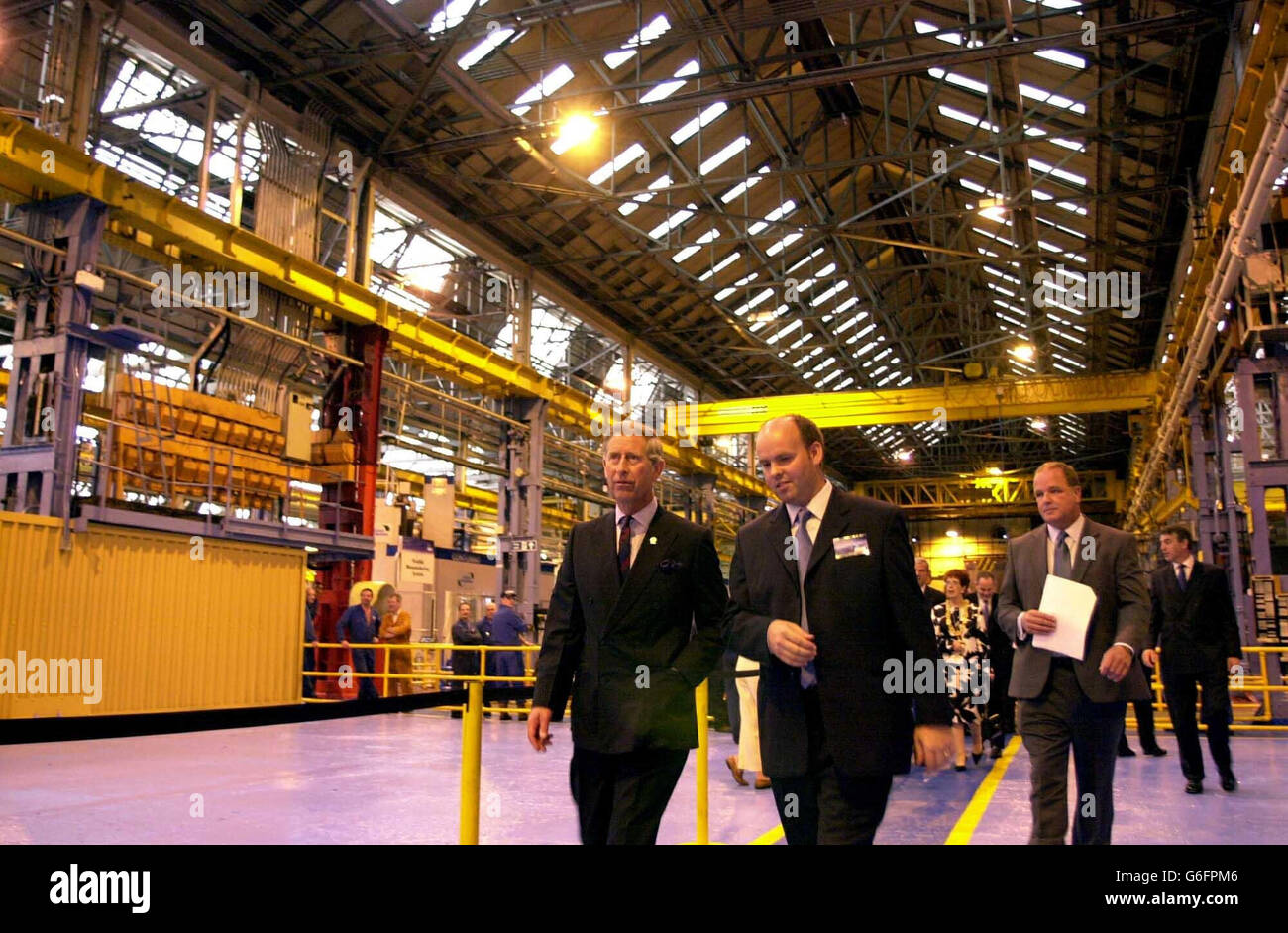 The Prince of Wales is guided through the factory at the Weir Pumps in Cathcart, Glasgow,where he visited workers at Scotland's largest engineering firm. Charles, known as the Duke of Rothesay in Scotland, dropped in on staff and management at the Weir Group in Glasgow at the start of a day of visits around the country. Weir employs around 8,000 people worldwide making specialist pumping equipment from the defence and nuclear industries to the power generation and water treatment sectors. Stock Photo