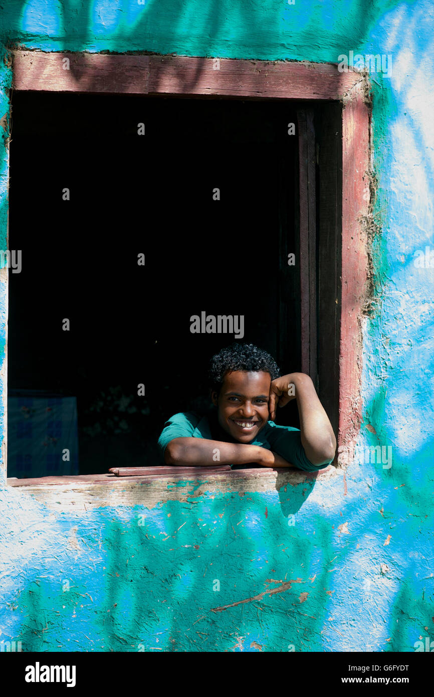 Portrait of an Ethiopian man in window. Near Alamata and Korem, Ethiopia Stock Photo