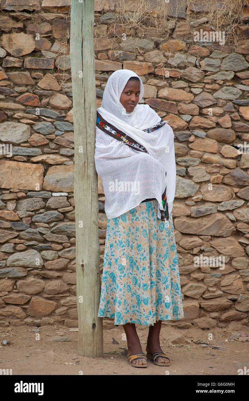 Ethiopian woman waiting for transport. Axum, Ethiopia Stock Photo