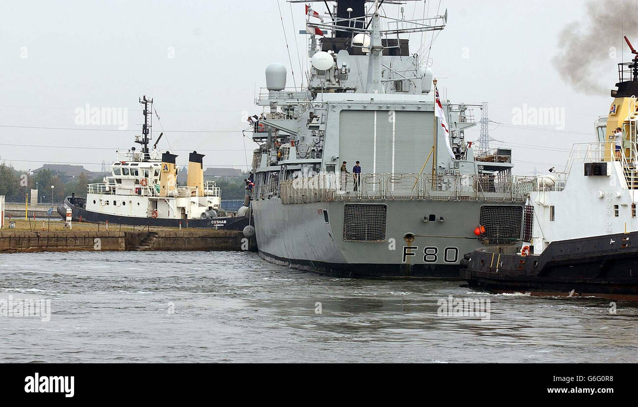 The Royal Navy Frigate, HMS Grafton, arrives at the Royal Docks on the Thames, near City London Airport, ahead of the European Military Arms Trade Fair, which will be held at the Excel Centre in London's docklands next week. Stock Photo